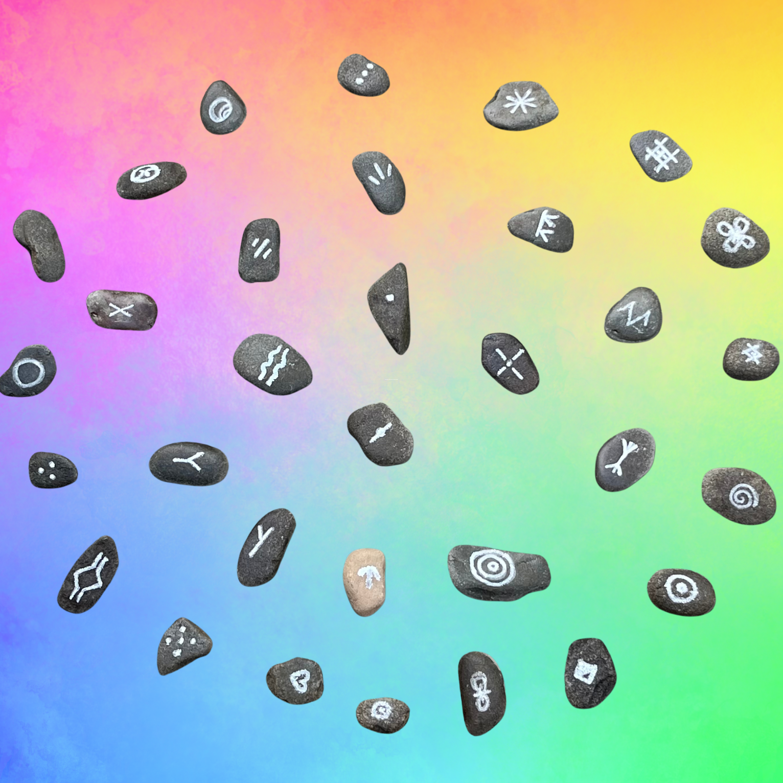 Symbols on stones used for energy readings in a spiral shape with soft rainbow background